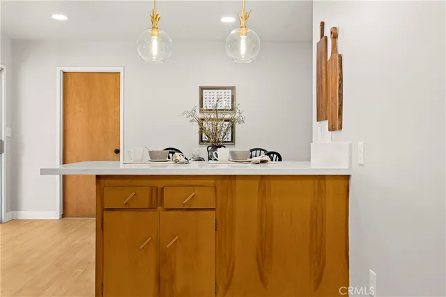 a bathroom with a sink a mirror and a window