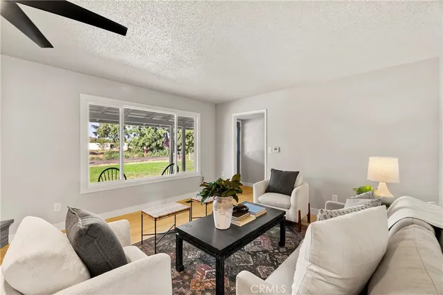 a living room with furniture and a window