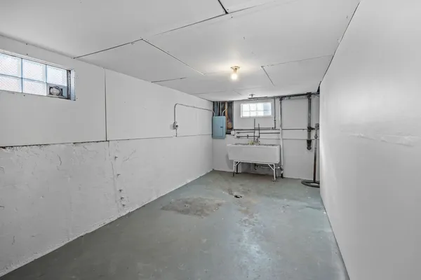 a view of a storage & utility room with windows