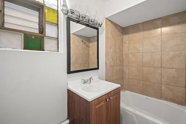 a bathroom with a sink and a bathtub