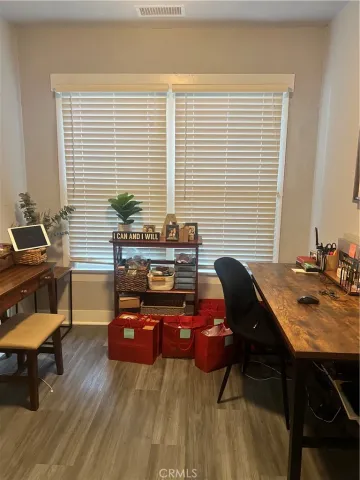 a workspace with furniture and window