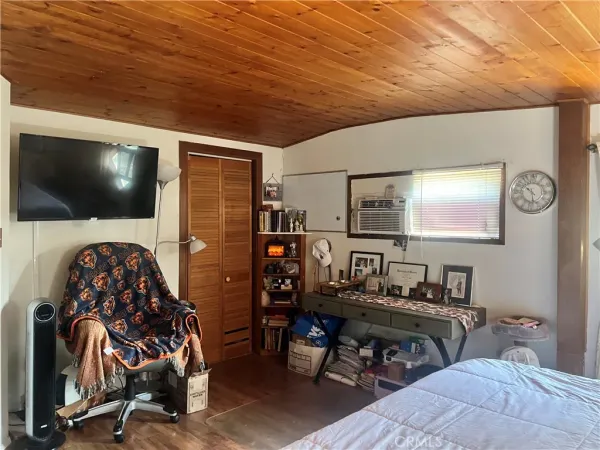 a livingroom with furniture and a flat screen tv