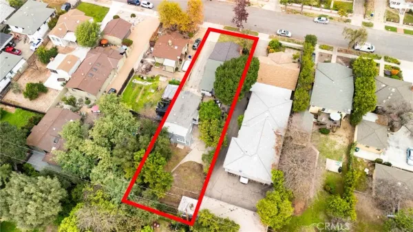 an aerial view of a multi story residential apartment building with yard