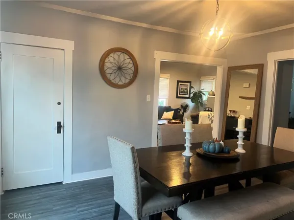 a view of a dining room with a table and chairs