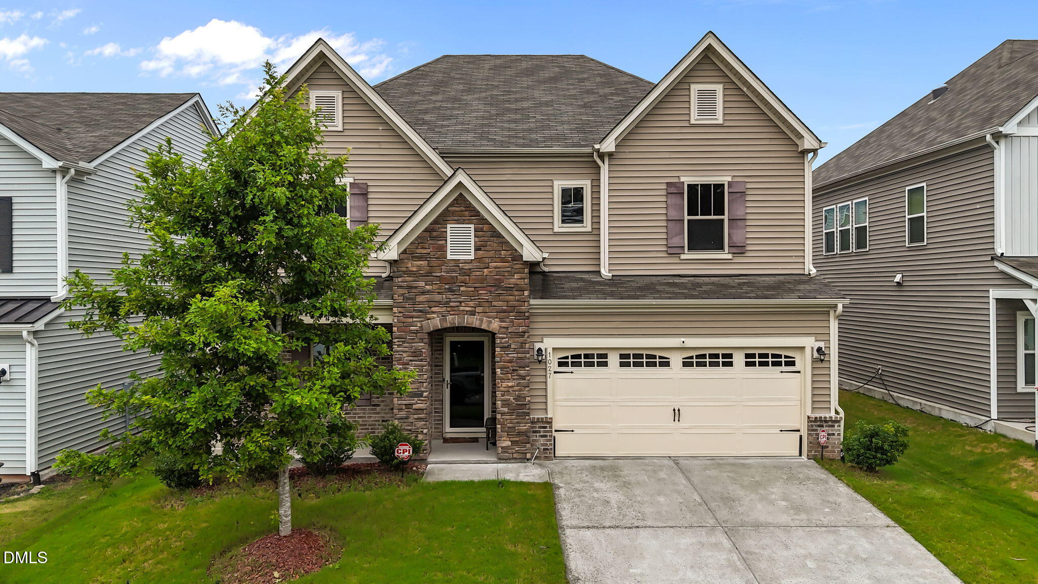 1027 Janiskee Road Durham, NC 27703 - Photo 1 of 36 a front view of a house with a yard
