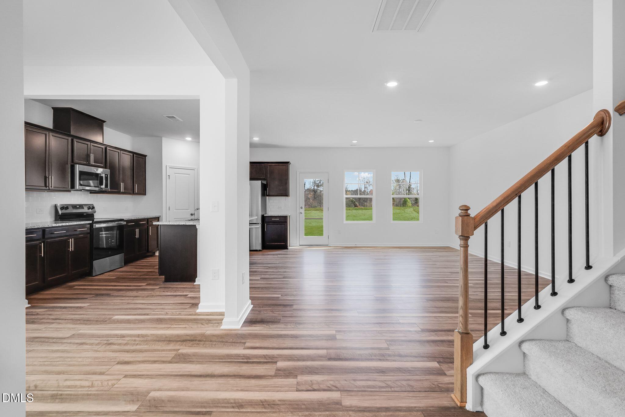 5818 Millstone Way Sims, NC 27880 - Photo 5 of 24 a view of a living room kitchen and a wooden floor
