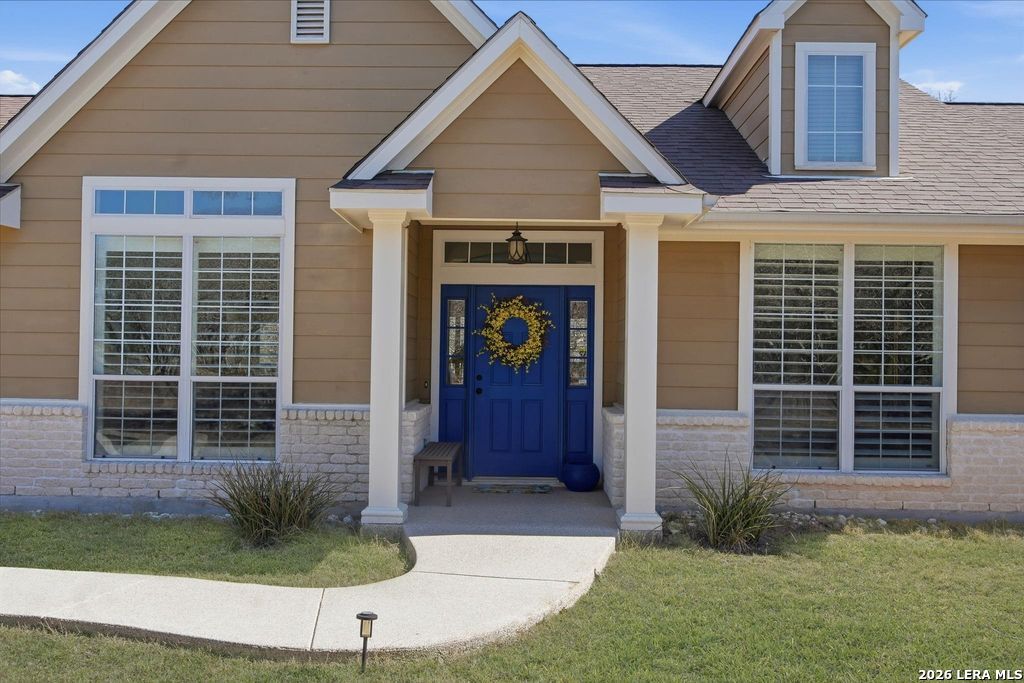 318 River Ridge Boerne, TX 78006 - Photo 5 of 46 a front view of a house with garden