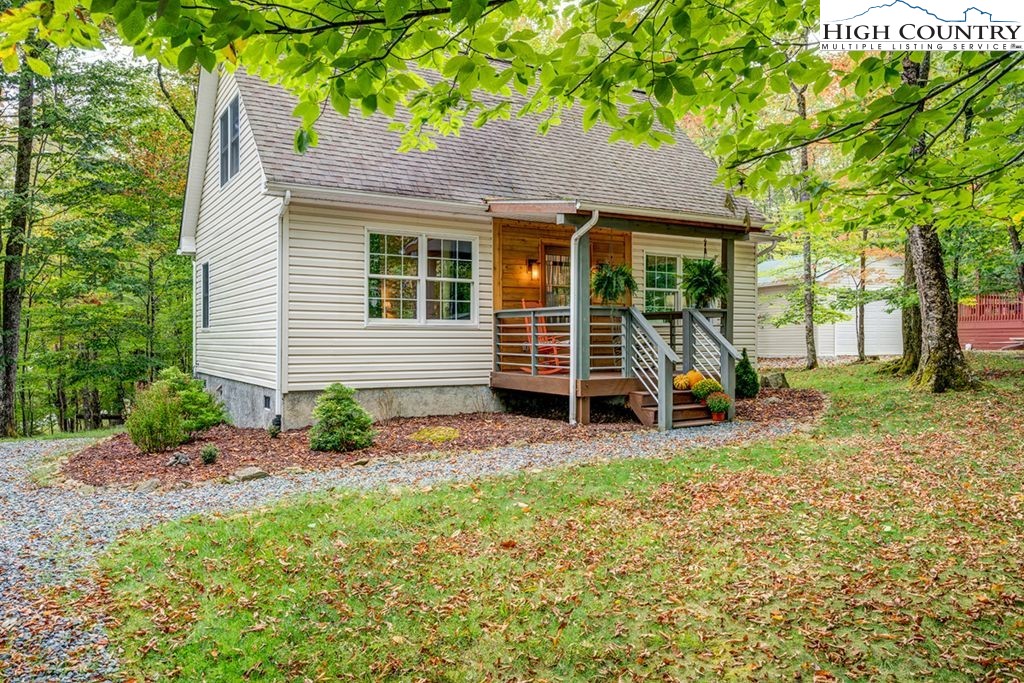607 Charter Hills Road Beech Mountain, NC 28604 - Photo 25 of 31 a view of a house with a yard and sitting area