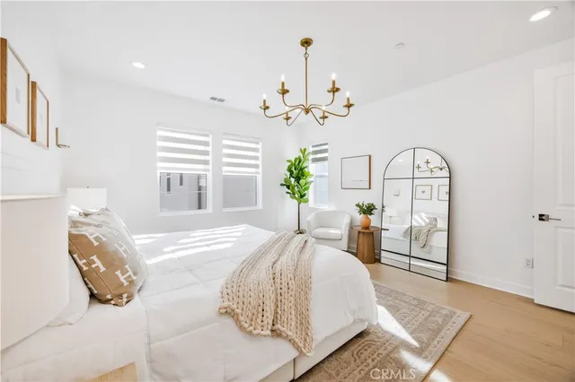 a bathroom with a double vanity sink mirror and next to the window