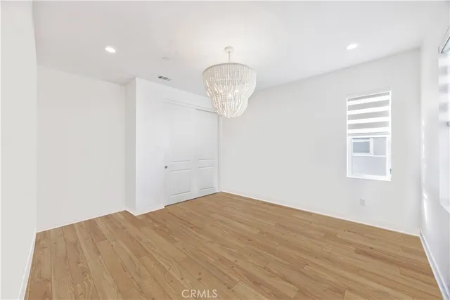 a bathroom with a granite countertop toilet a sink and a mirror