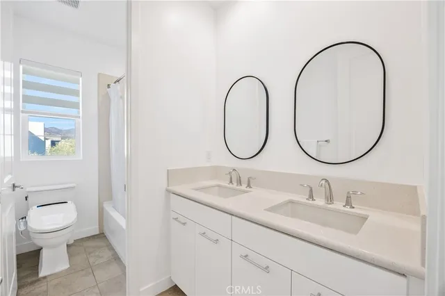 a bathroom with a toilet and a bathtub