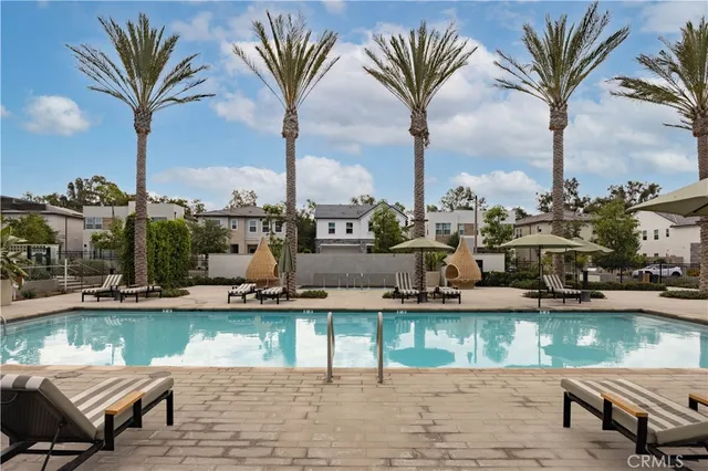 a view of swimming pool with outdoor seating