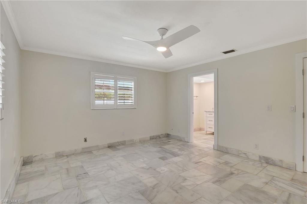112 Capri Boulevard Naples, FL 34113 - Photo 17 of 39 a view of an empty room with a window