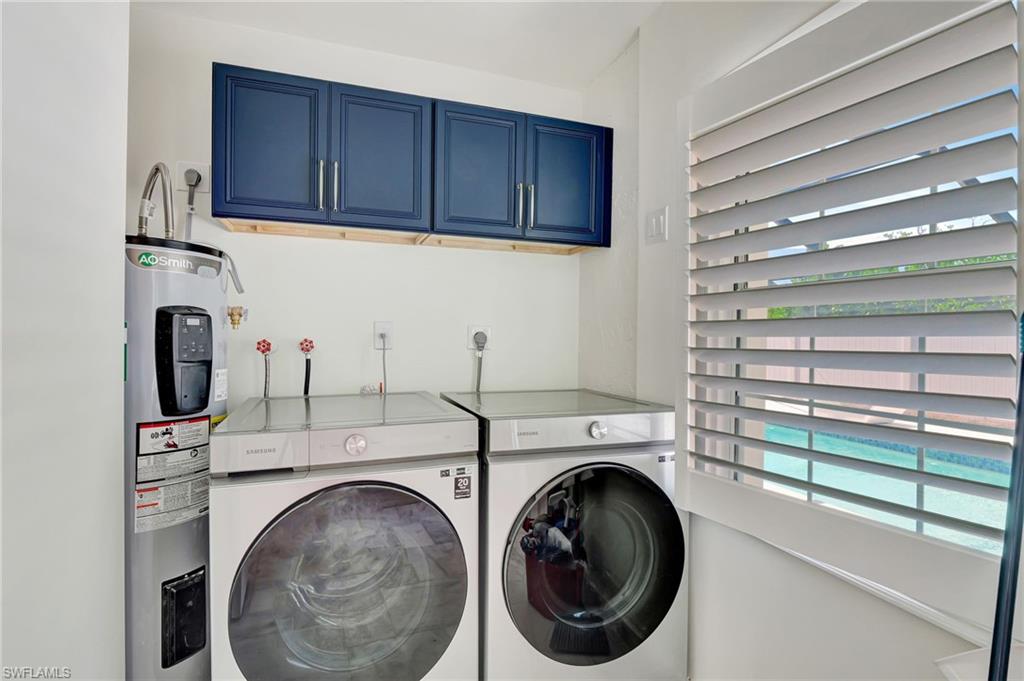 112 Capri Boulevard Naples, FL 34113 - Photo 28 of 39 a utility room with dryer and washer