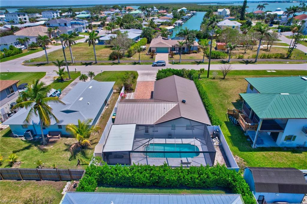 112 Capri Boulevard Naples, FL 34113 - Photo 3 of 39 an aerial view of a house with a garden