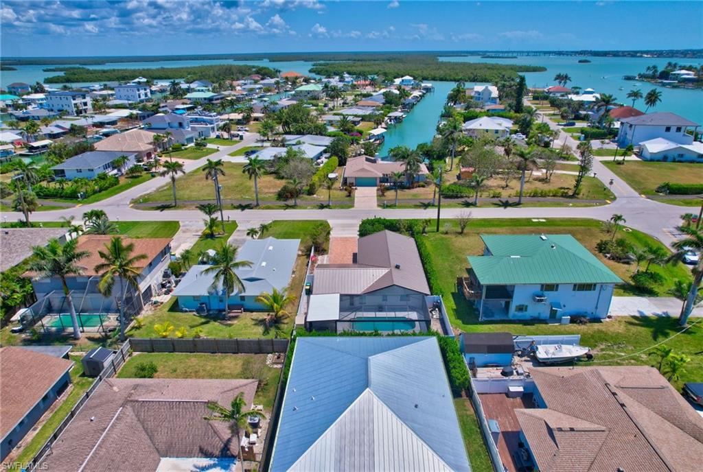 112 Capri Boulevard Naples, FL 34113 - Photo 36 of 39 an aerial view of a houses with a swimming pool