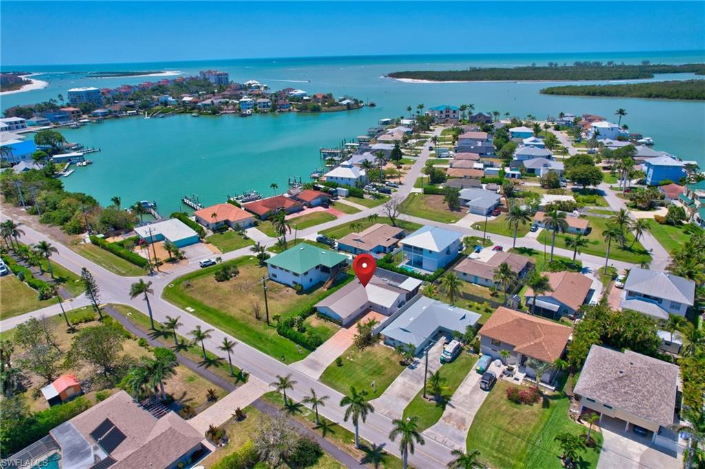 112 Capri Boulevard Naples, FL 34113 - Photo 38 of 39 an aerial view of ocean and residential houses with outdoor space