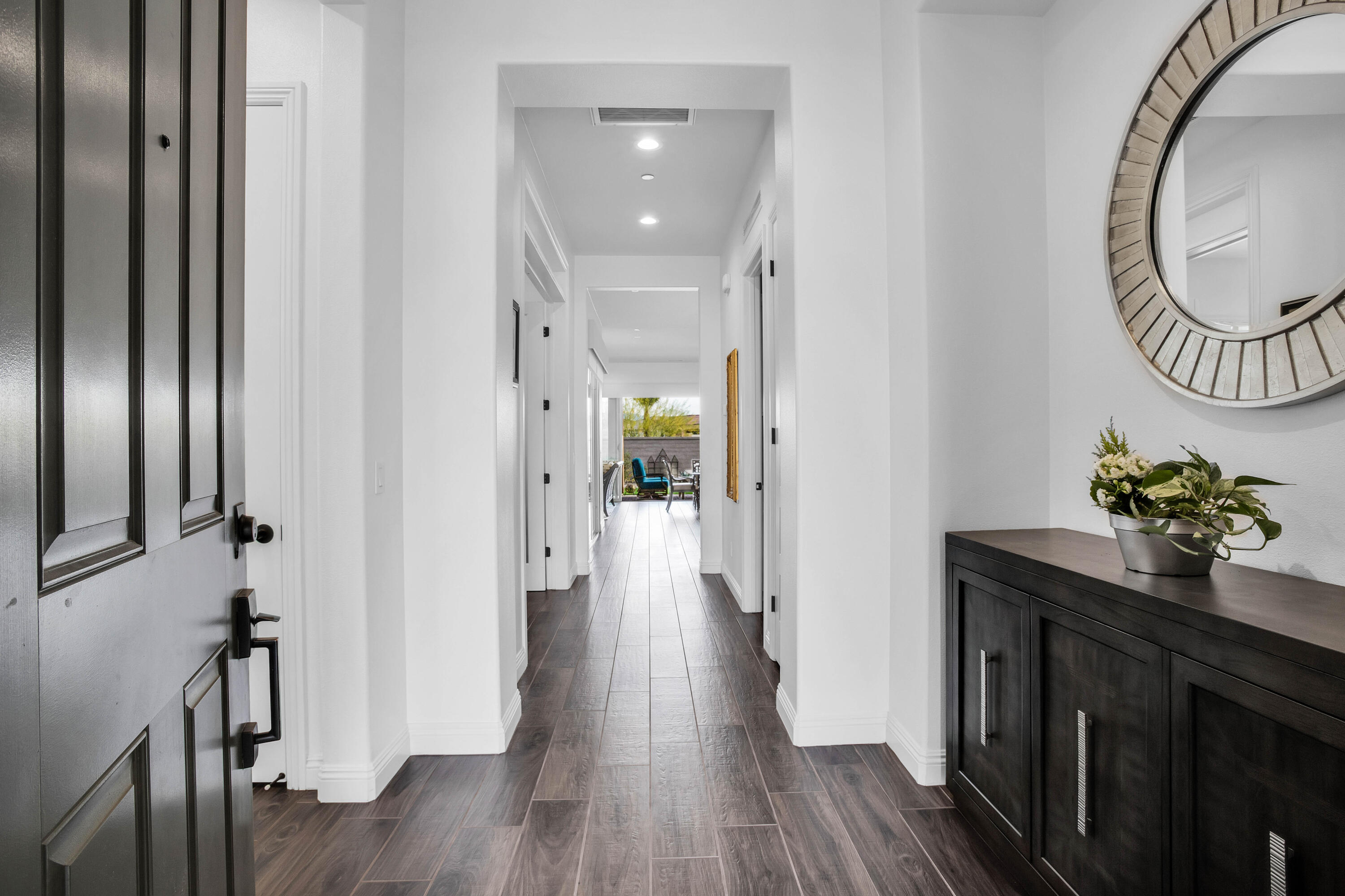 32 Cork Tree Rancho Mirage, CA 92270 - Photo 16 of 58 a view of a hallway with wooden floor and staircase