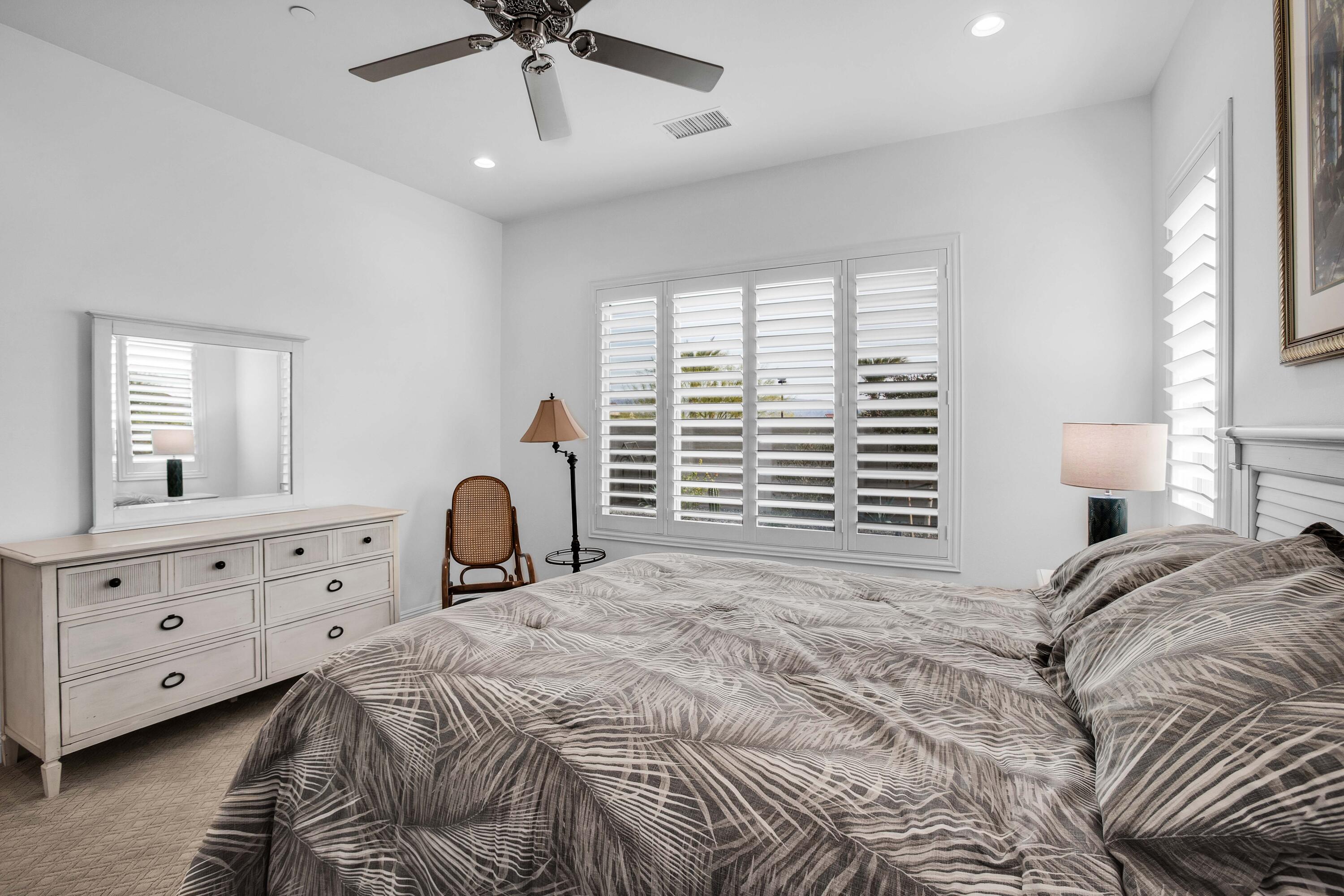32 Cork Tree Rancho Mirage, CA 92270 - Photo 23 of 58 a bedroom with a bed and a window