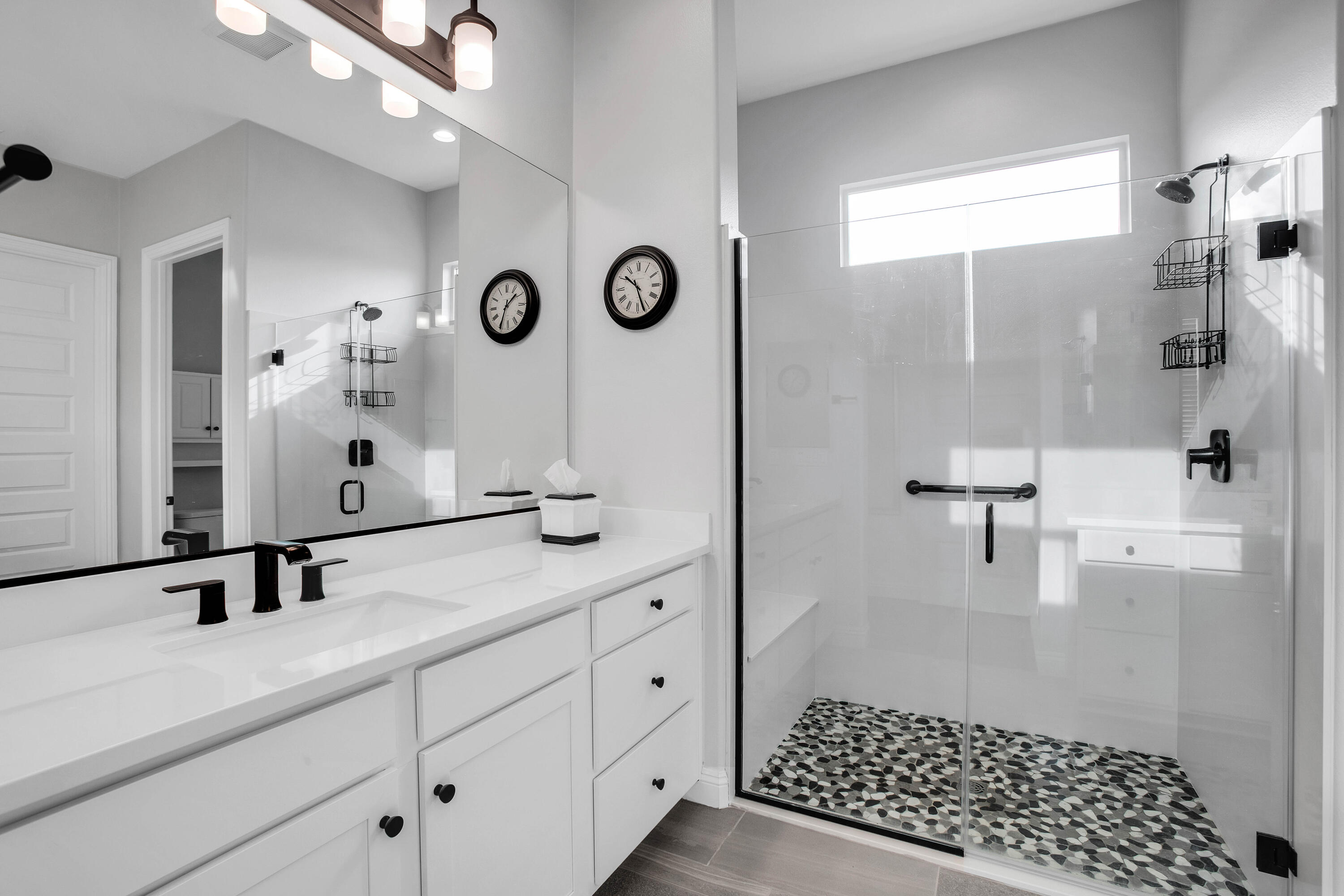32 Cork Tree Rancho Mirage, CA 92270 - Photo 24 of 58 a bathroom with a double vanity sink a mirror and shower