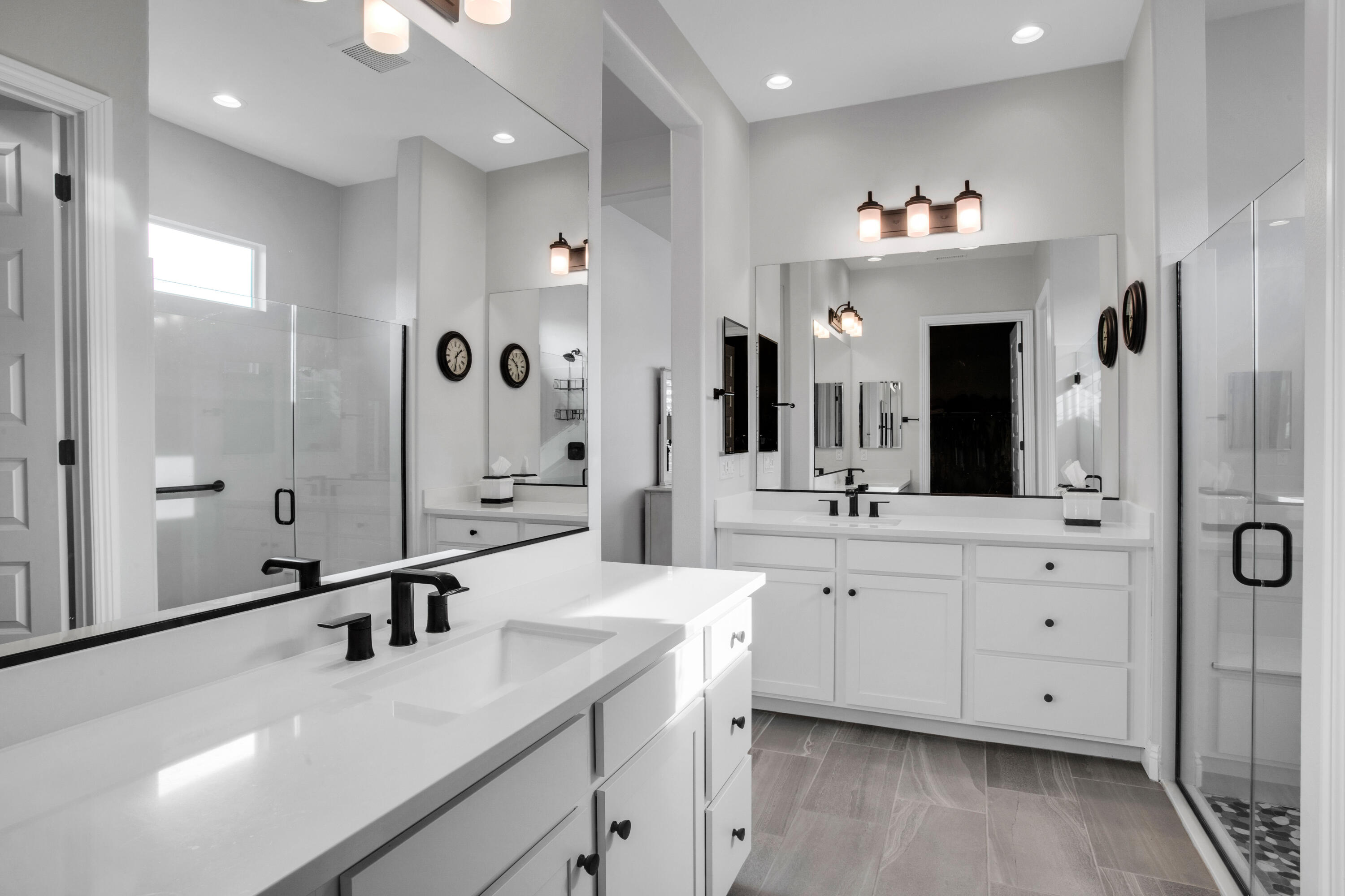 32 Cork Tree Rancho Mirage, CA 92270 - Photo 25 of 58 a bathroom with a double vanity sink mirror double and shower