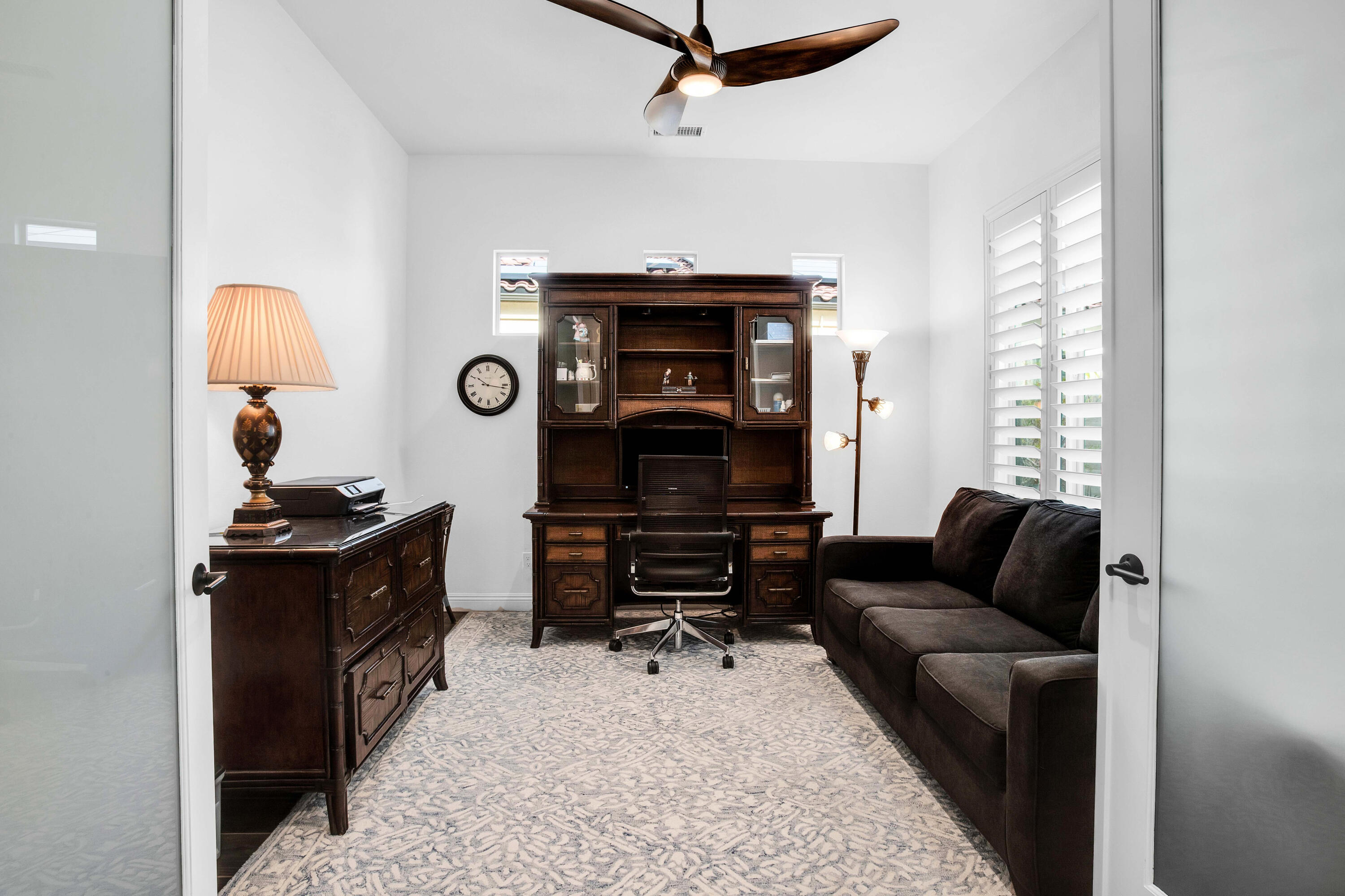 32 Cork Tree Rancho Mirage, CA 92270 - Photo 29 of 58 a living room with furniture and a fireplace