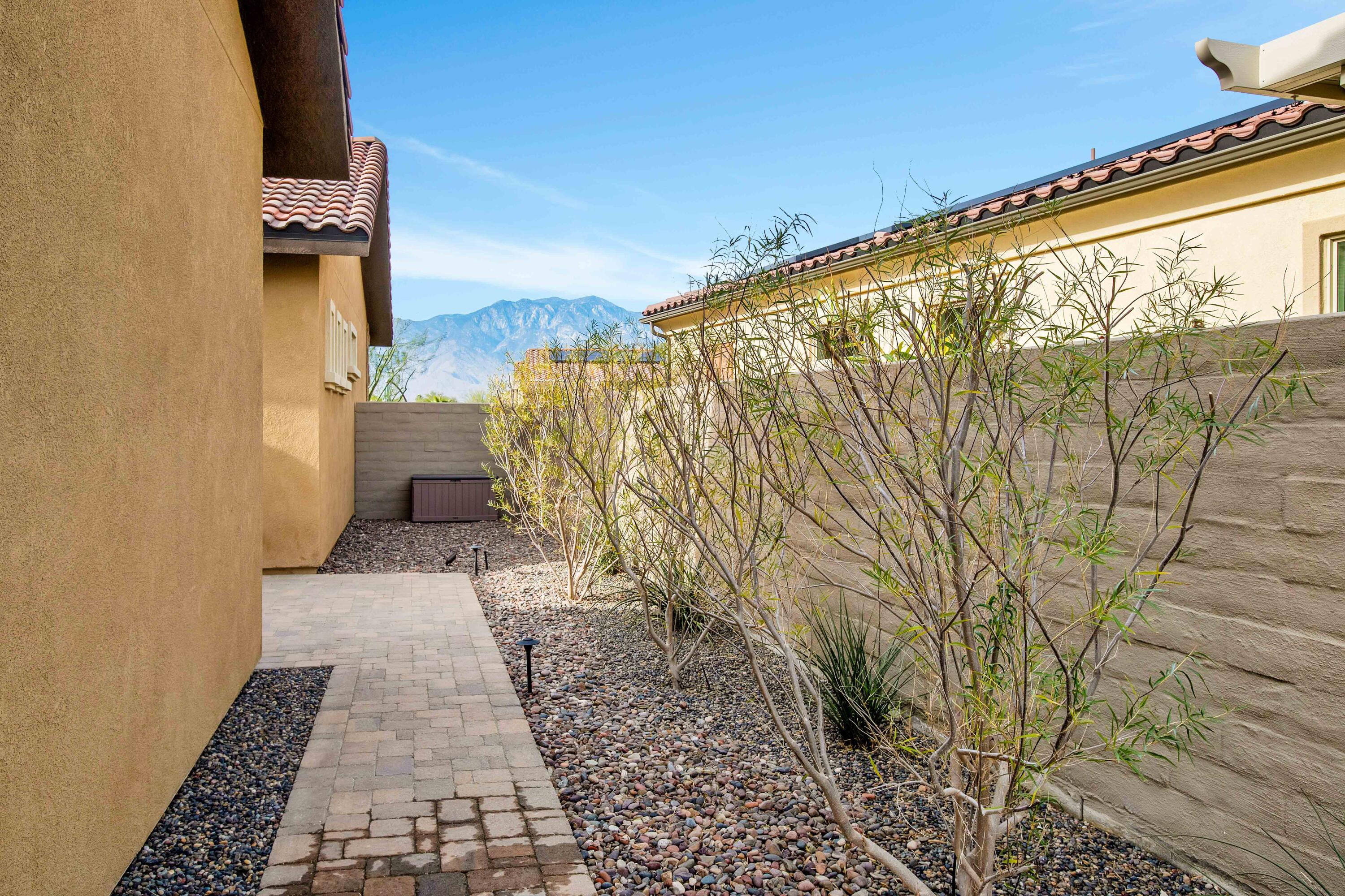 32 Cork Tree Rancho Mirage, CA 92270 - Photo 35 of 58 a view of a pathway both side of house
