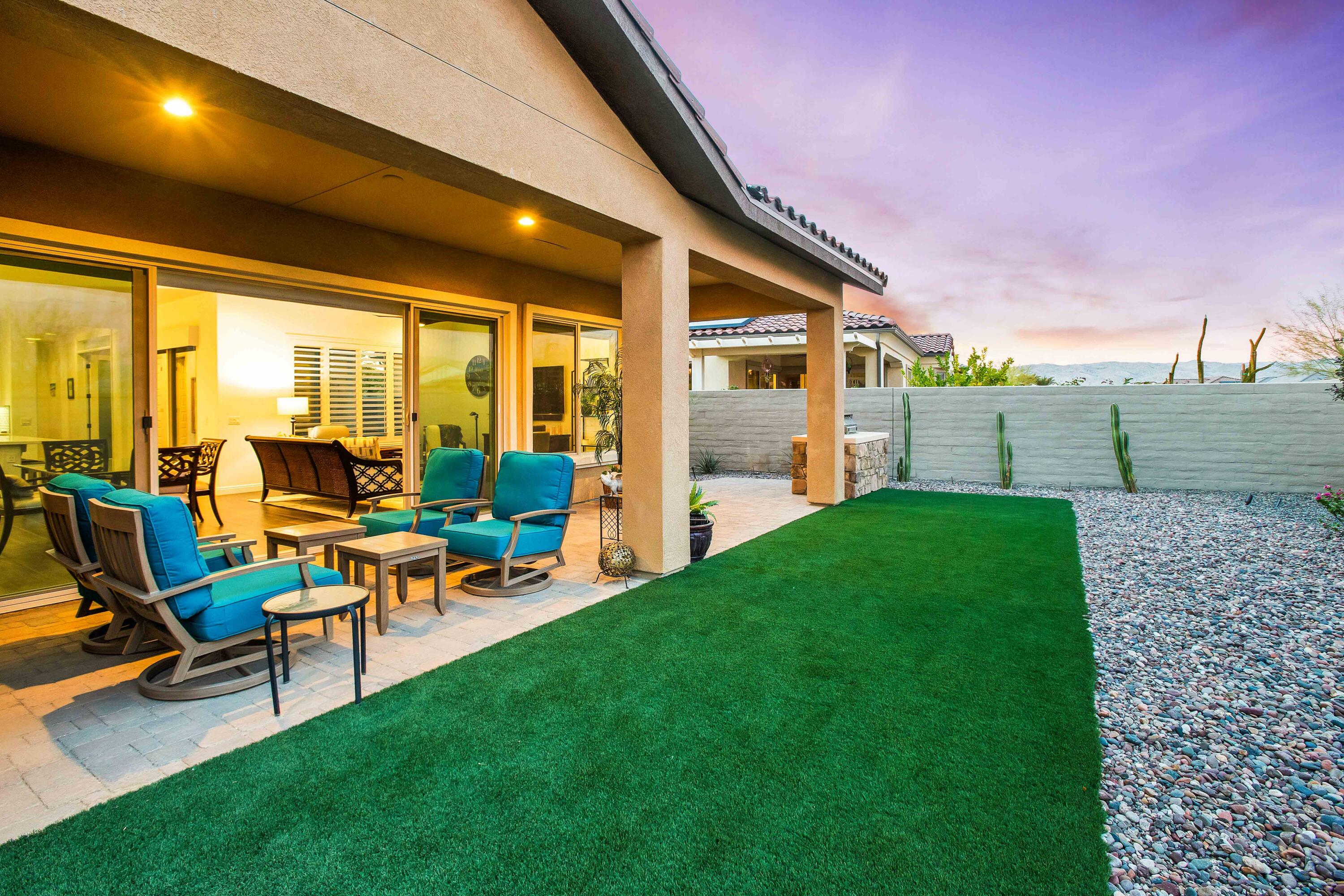 32 Cork Tree Rancho Mirage, CA 92270 - Photo 5 of 58 a view of a patio with table and chairs and floor to ceiling window