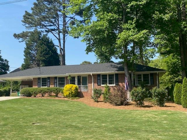 2992 Lavista Court Decatur, GA 30033 - Photo 1 of 1 a front view of a house with a garden
