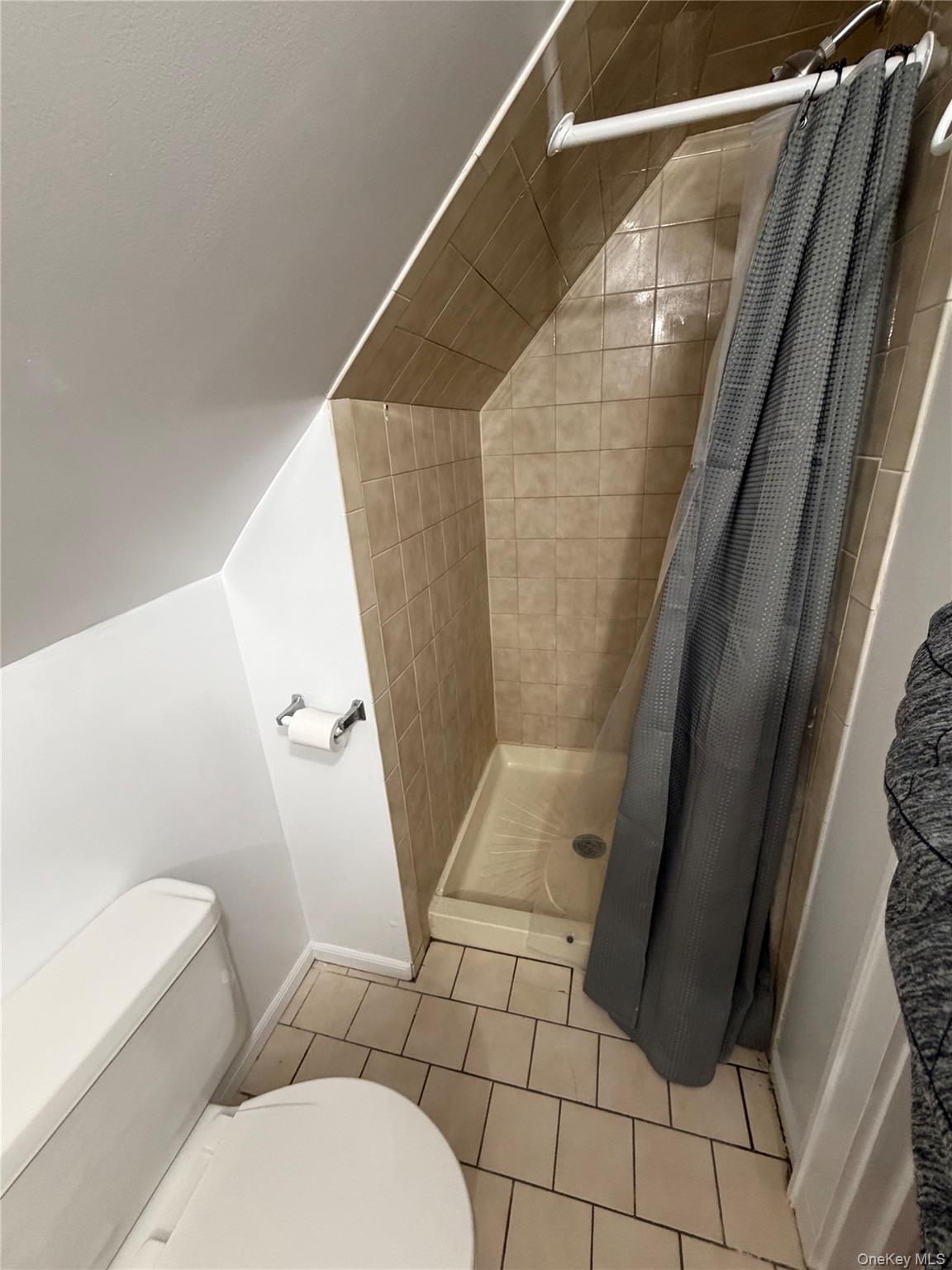 196 Depew Avenue, Unit 3 Nyack, NY 10960 - Photo 6 of 15 Bathroom featuring a shower stall and light tile patterned floors