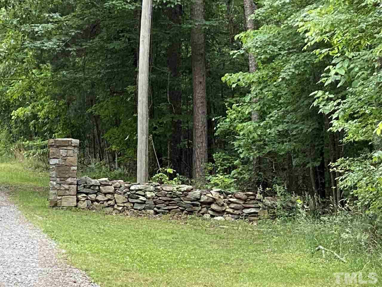 1816 Harris Road Rougemont, NC 27572 - Photo 4 of 12 a view of a chair and table in the garden