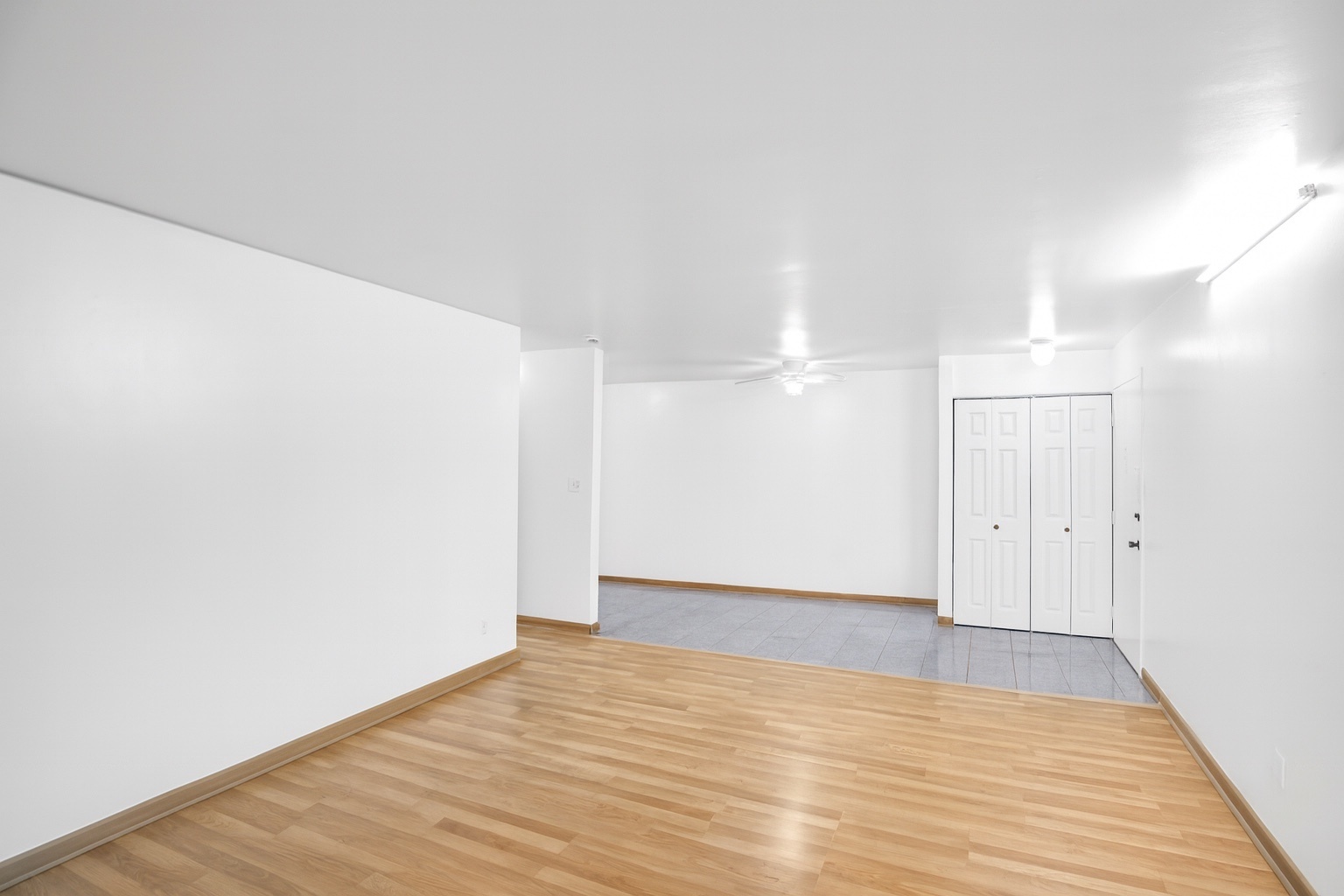1080 Knoll Lane, Unit 305 Hoffman Estates, IL 60169 - Photo 5 of 10 a view of an empty room with wooden floor