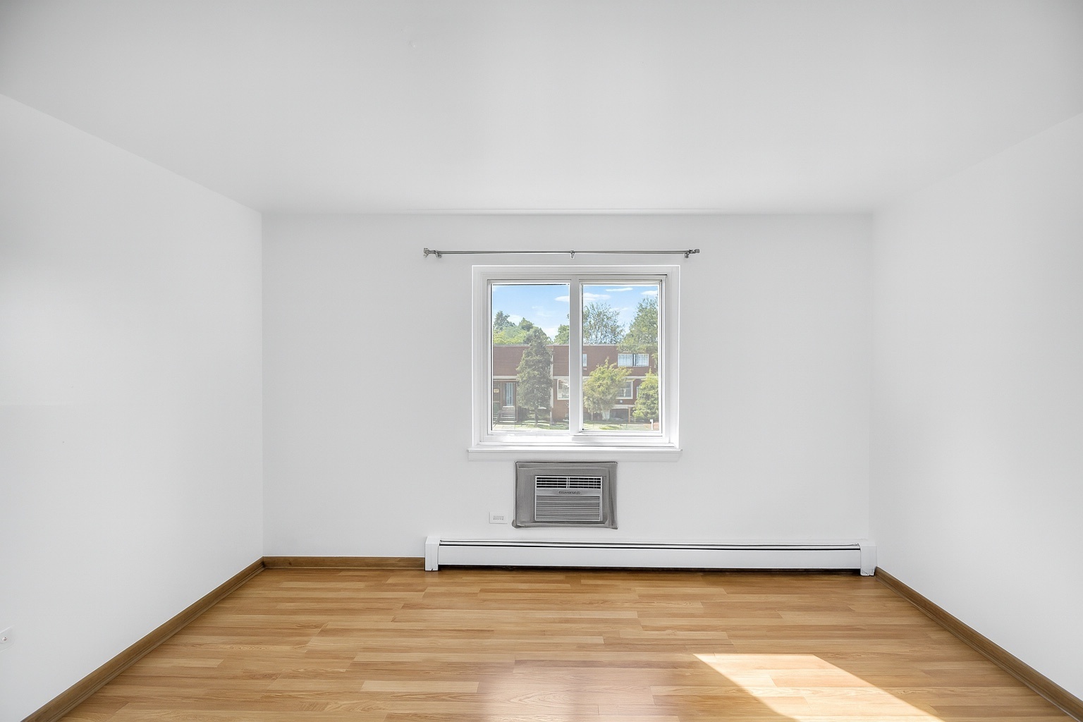 1080 Knoll Lane, Unit 305 Hoffman Estates, IL 60169 - Photo 8 of 10 an empty room with a window