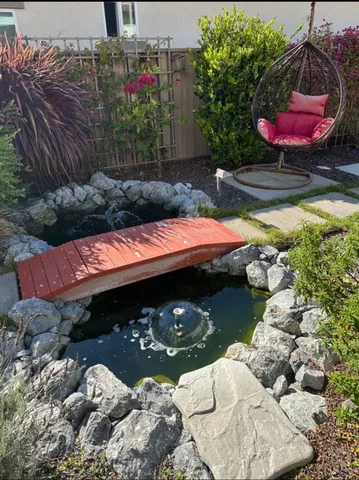 a view of swimming pool with a yard