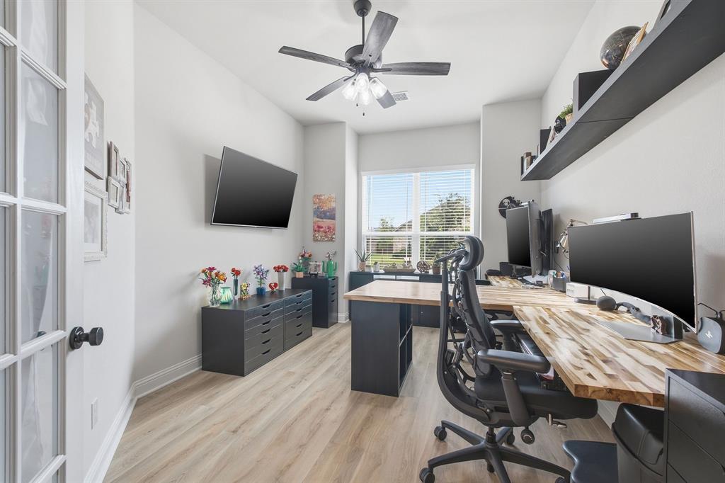 313 Tate Lane Anna, TX 75409 - Photo 6 of 30 Dedicated office space featuring light wood-finish flooring, a ceiling fan, and large windows with blinds