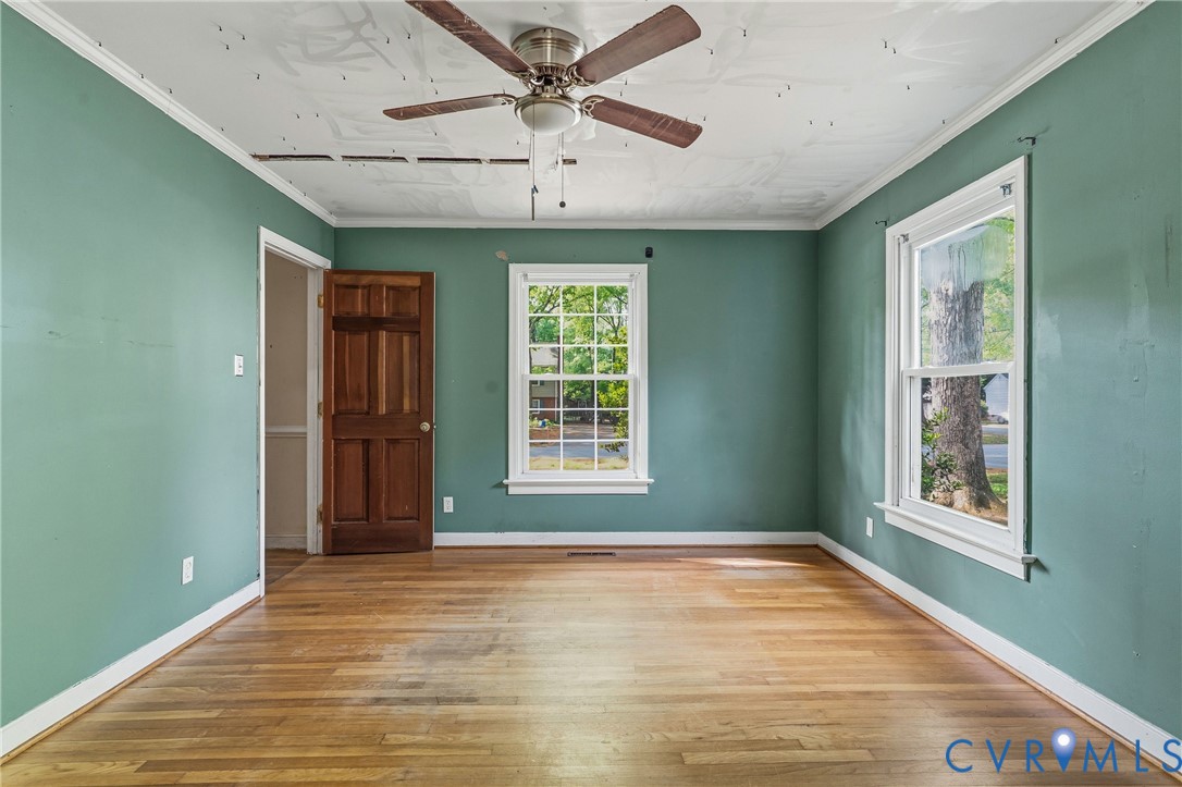 11840 Winfore Drive Midlothian, VA 23113 - Photo 15 of 59 a view of an empty room with wooden floor and a window