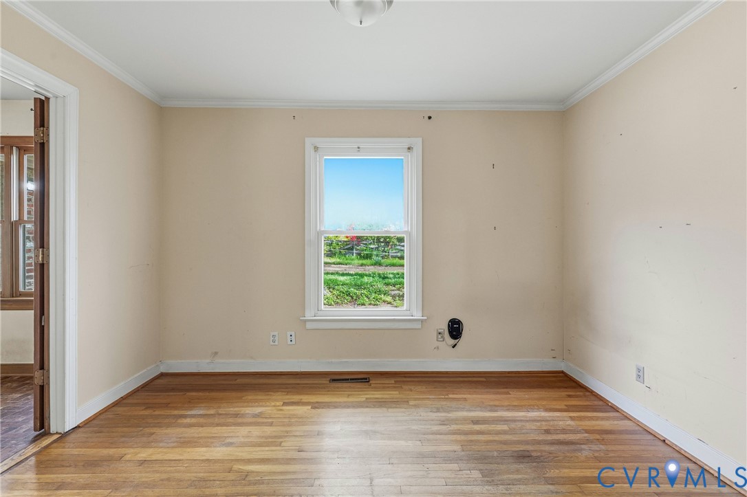 11840 Winfore Drive Midlothian, VA 23113 - Photo 20 of 59 a view of an empty room with wooden floor and a window