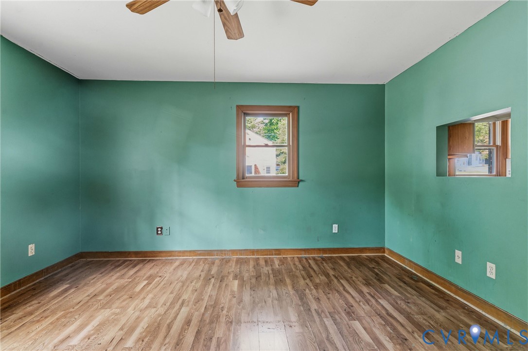 11840 Winfore Drive Midlothian, VA 23113 - Photo 26 of 59 a view of a room with wooden floor and a ceiling fan