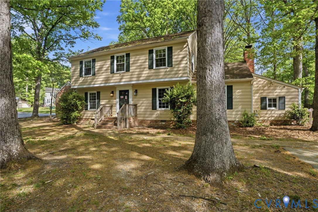 11840 Winfore Drive Midlothian, VA 23113 - Photo 3 of 59 a front view of a house with garden