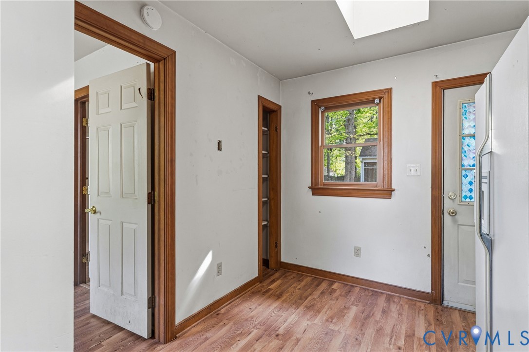 11840 Winfore Drive Midlothian, VA 23113 - Photo 31 of 59 a view of an empty room with wooden floor and a window