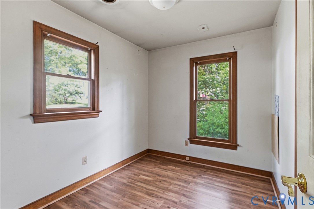 11840 Winfore Drive Midlothian, VA 23113 - Photo 32 of 59 a view of an empty room with wooden floor and a window