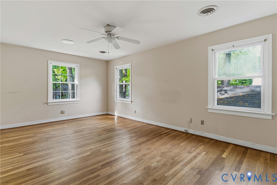 11840 Winfore Drive Midlothian, VA 23113 - Photo 37 of 59 a view of an empty room with wooden floor and a window