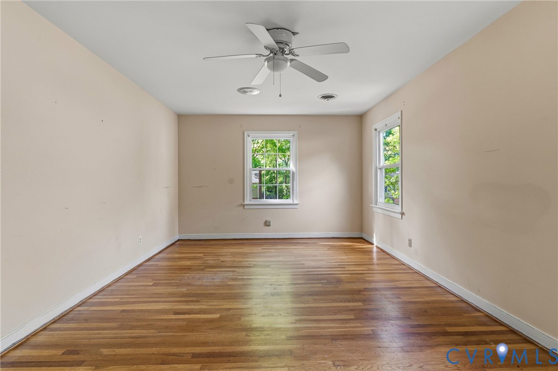 11840 Winfore Drive Midlothian, VA 23113 - Photo 38 of 59 an empty room with windows and a ceiling fan