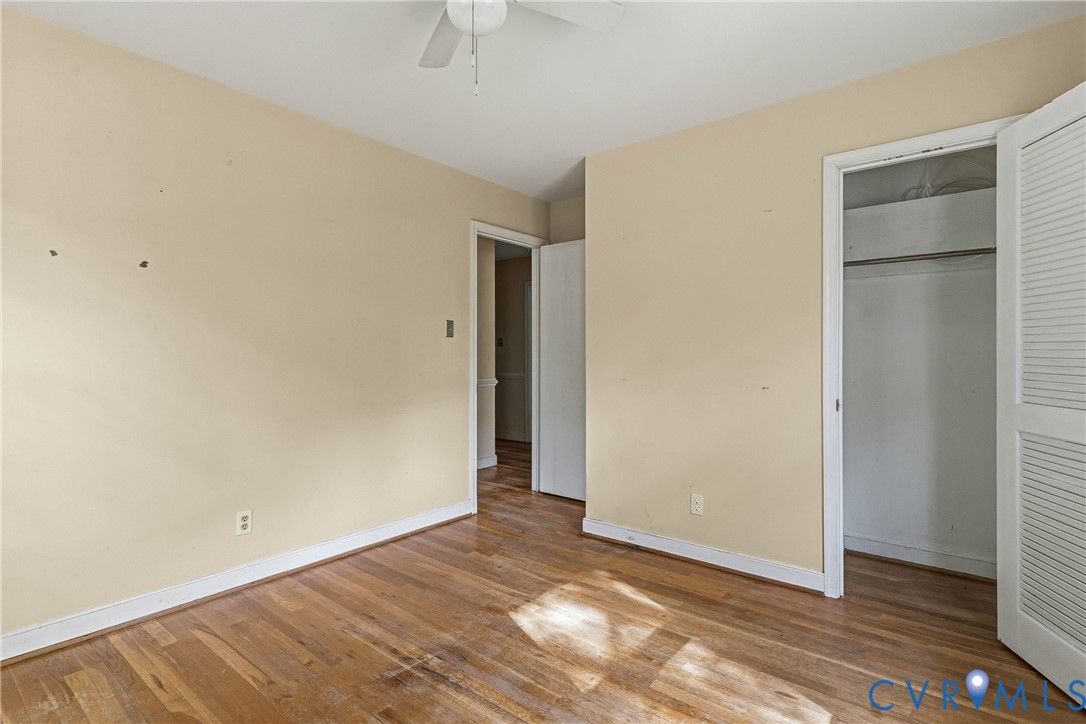 11840 Winfore Drive Midlothian, VA 23113 - Photo 43 of 59 a view of an empty room with wooden floor and closet