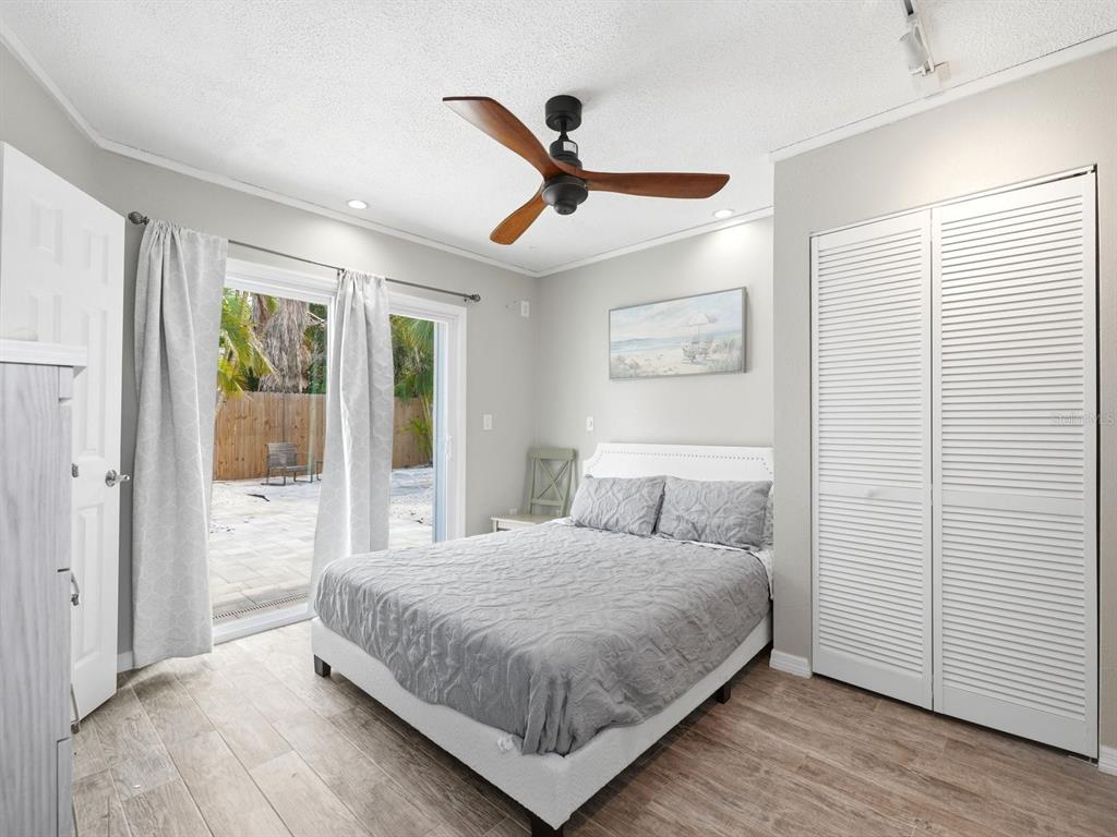 1207 1st Street Indian Rocks Beach, FL 33785 - Photo 18 of 60 a bedroom with a large bed and a window