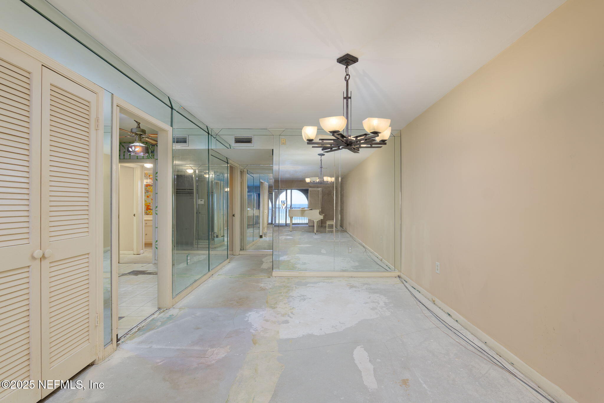 10 10th Street, Unit 2 Atlantic Beach, FL 32233 - Photo 13 of 43 a view of a hallway with a chandelier