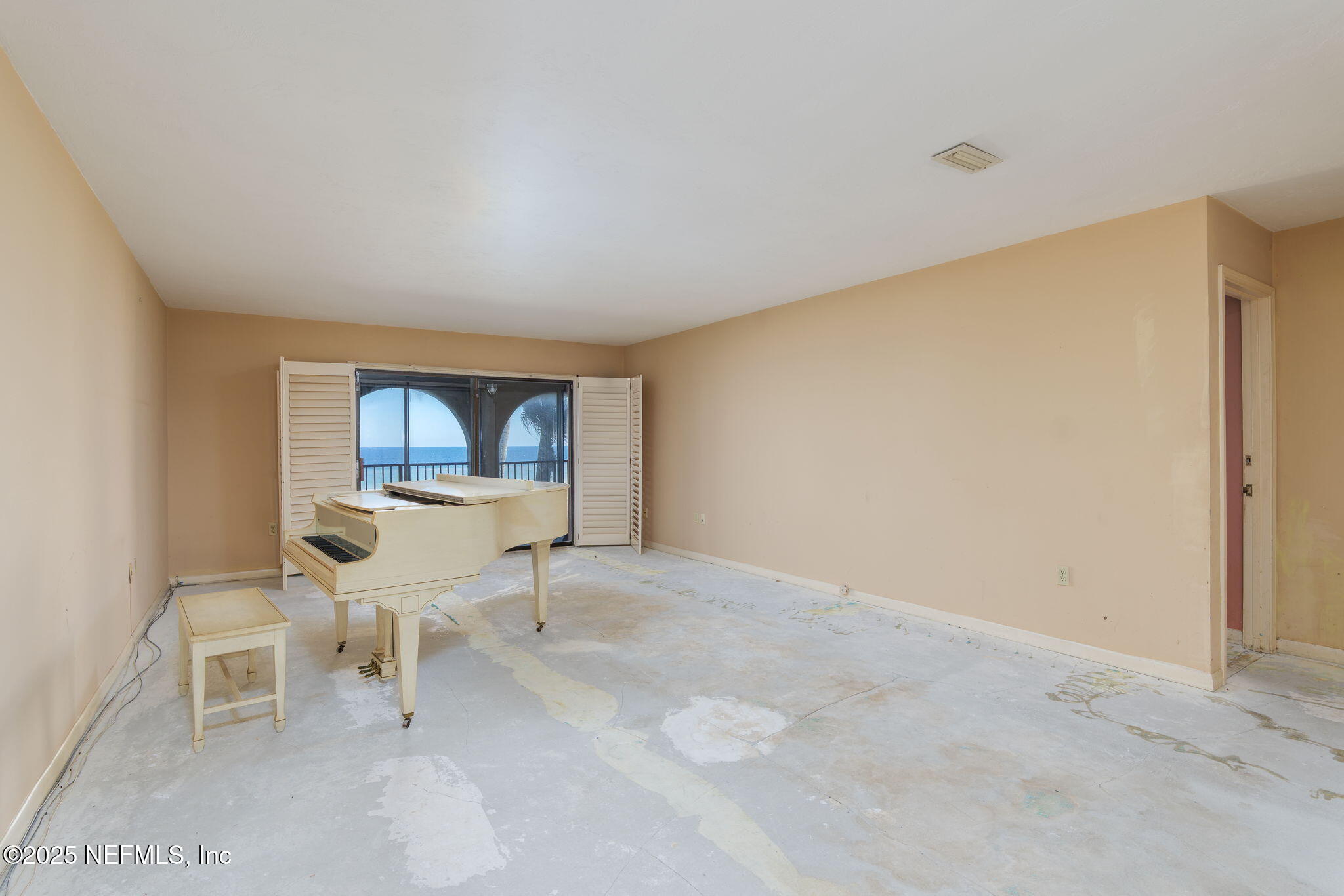 10 10th Street, Unit 2 Atlantic Beach, FL 32233 - Photo 15 of 43 a living room with furniture and a window