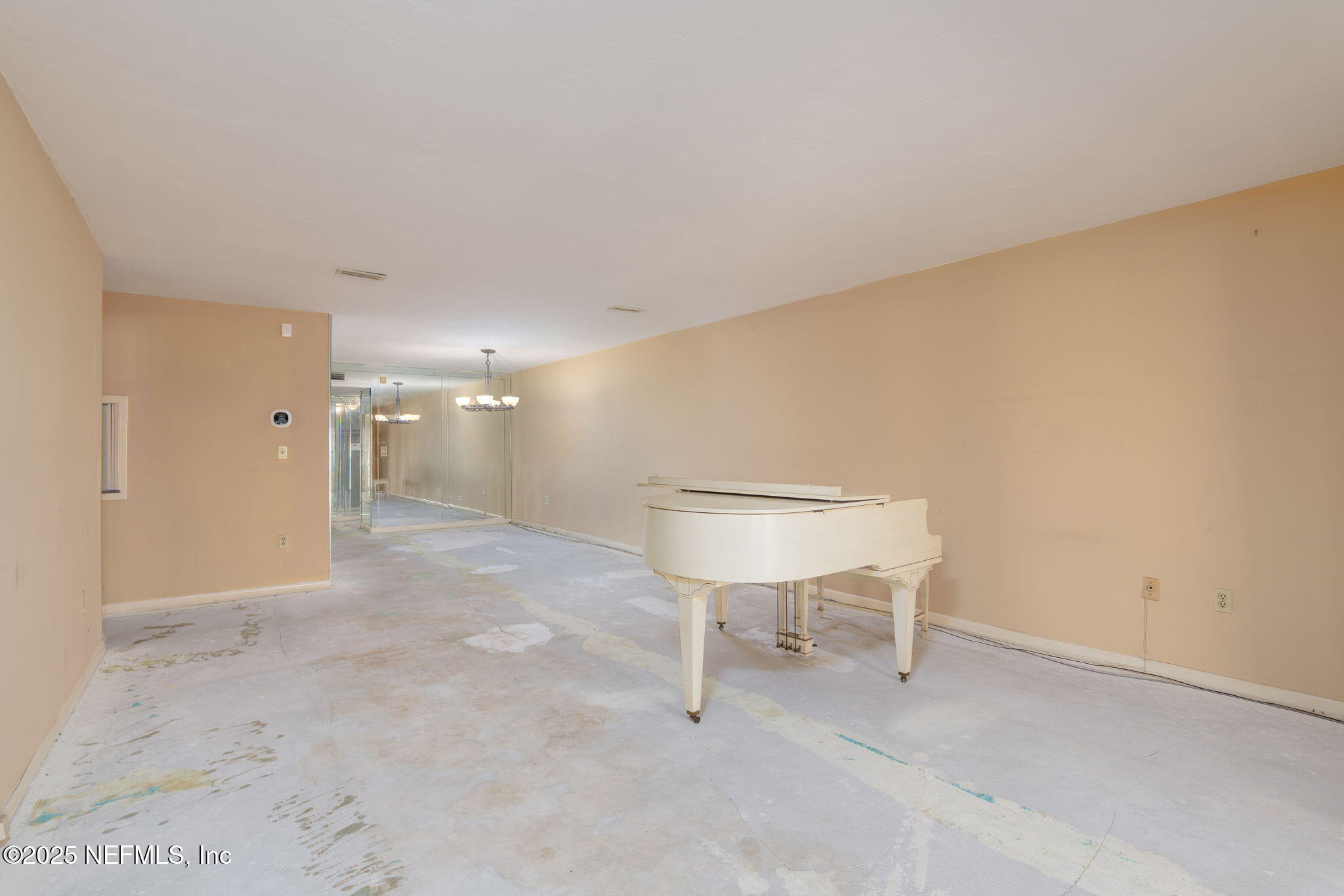 10 10th Street, Unit 2 Atlantic Beach, FL 32233 - Photo 16 of 43 a view of a room with table and chair