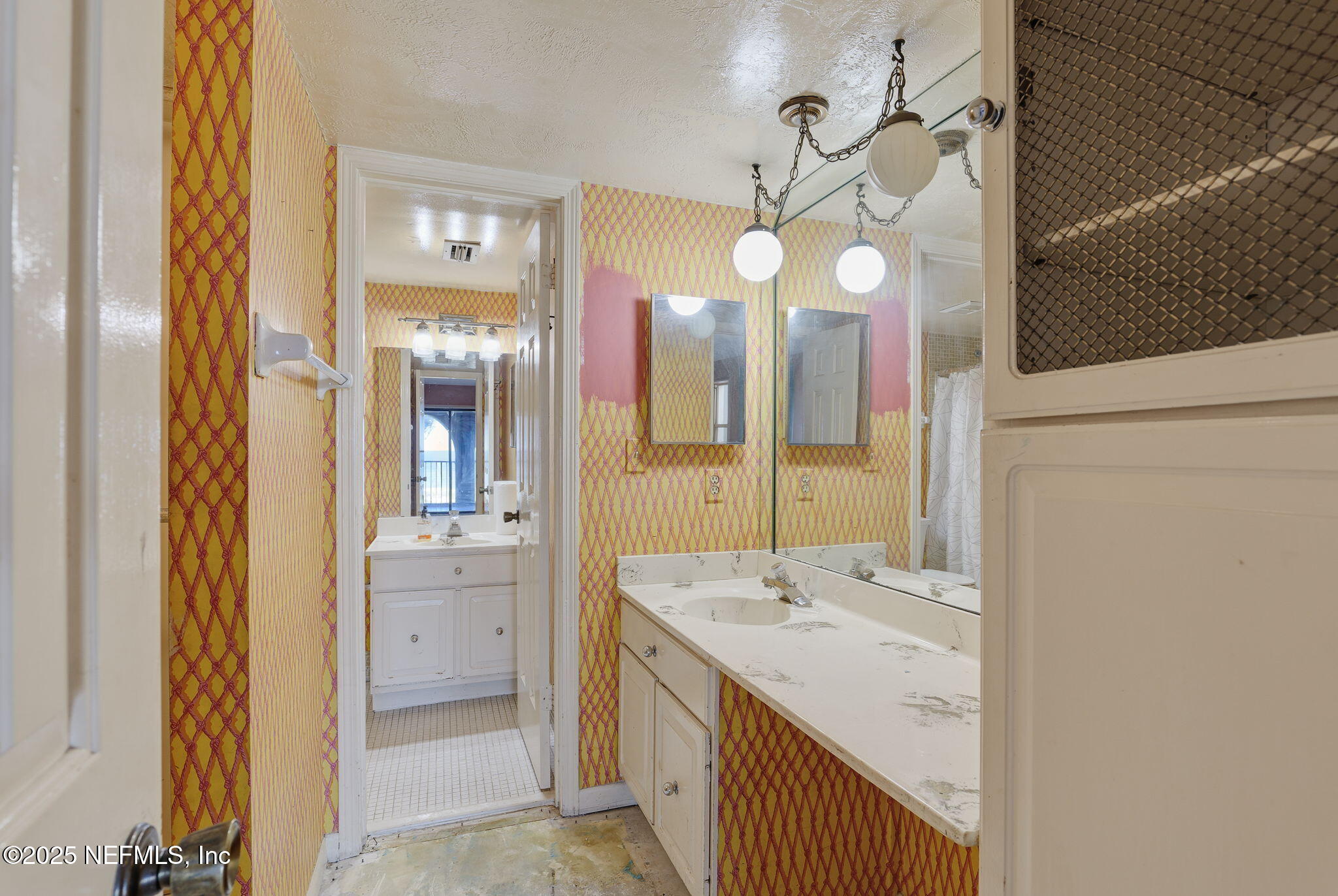 10 10th Street, Unit 2 Atlantic Beach, FL 32233 - Photo 21 of 41 a bathroom with a sink vanity and a mirror