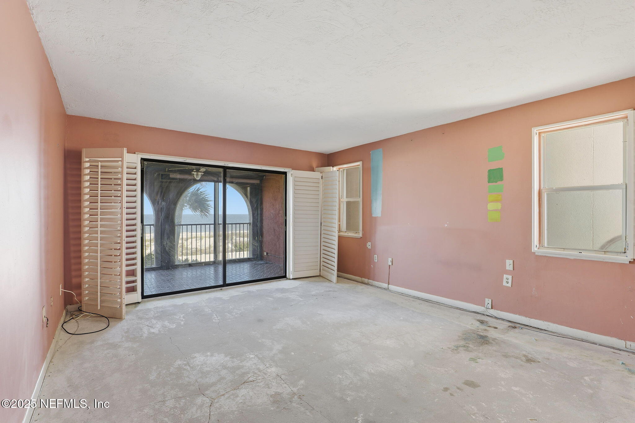 10 10th Street, Unit 2 Atlantic Beach, FL 32233 - Photo 21 of 43 an empty room with windows